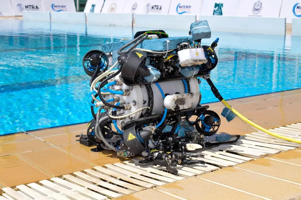 Overflow Robotics' competition ROV on the pool deck at MATE ROV